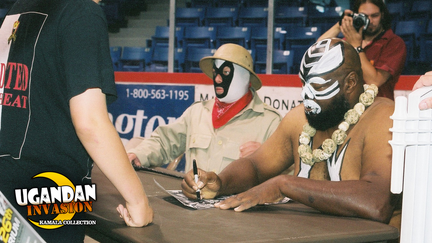 Kamala signing autographs for his fans